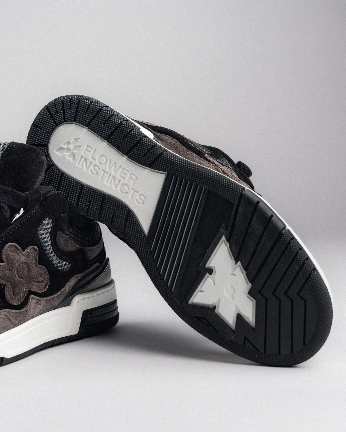 Flower Instincts is embossed underneath the two-tone rubber outsole.