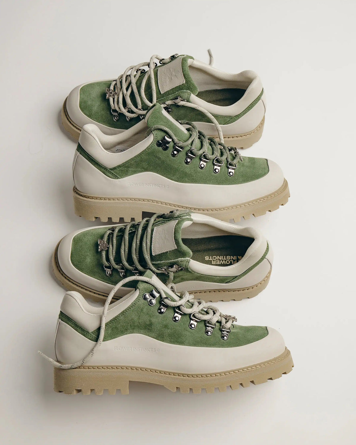 Two sets of laces: one green, one beige.