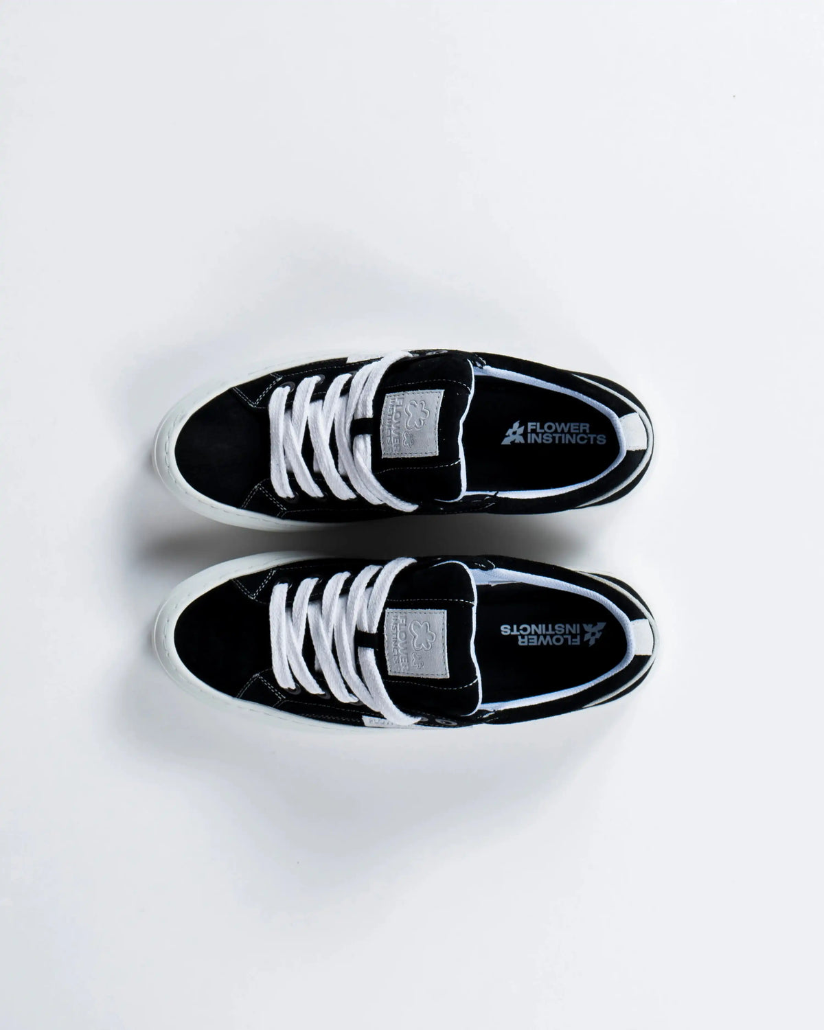 A padded tongue with white contrast stitching.