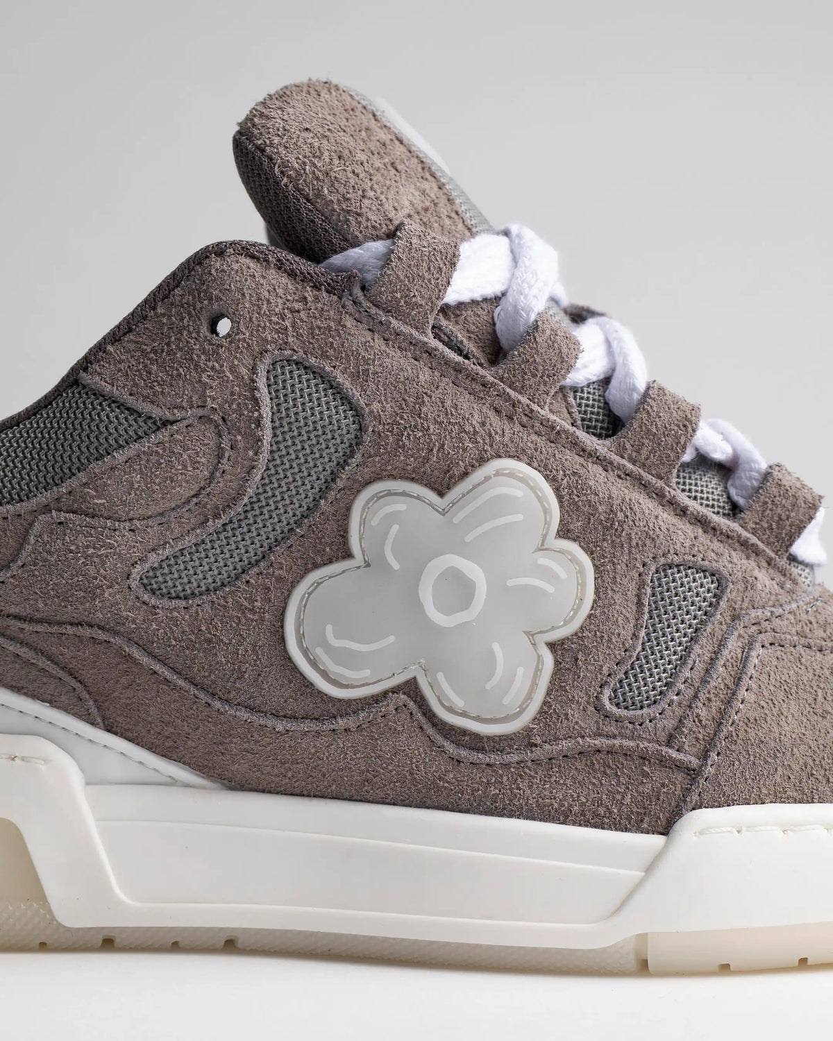 Translucent rubber against grey suede. Handcrafted in Portugal.
