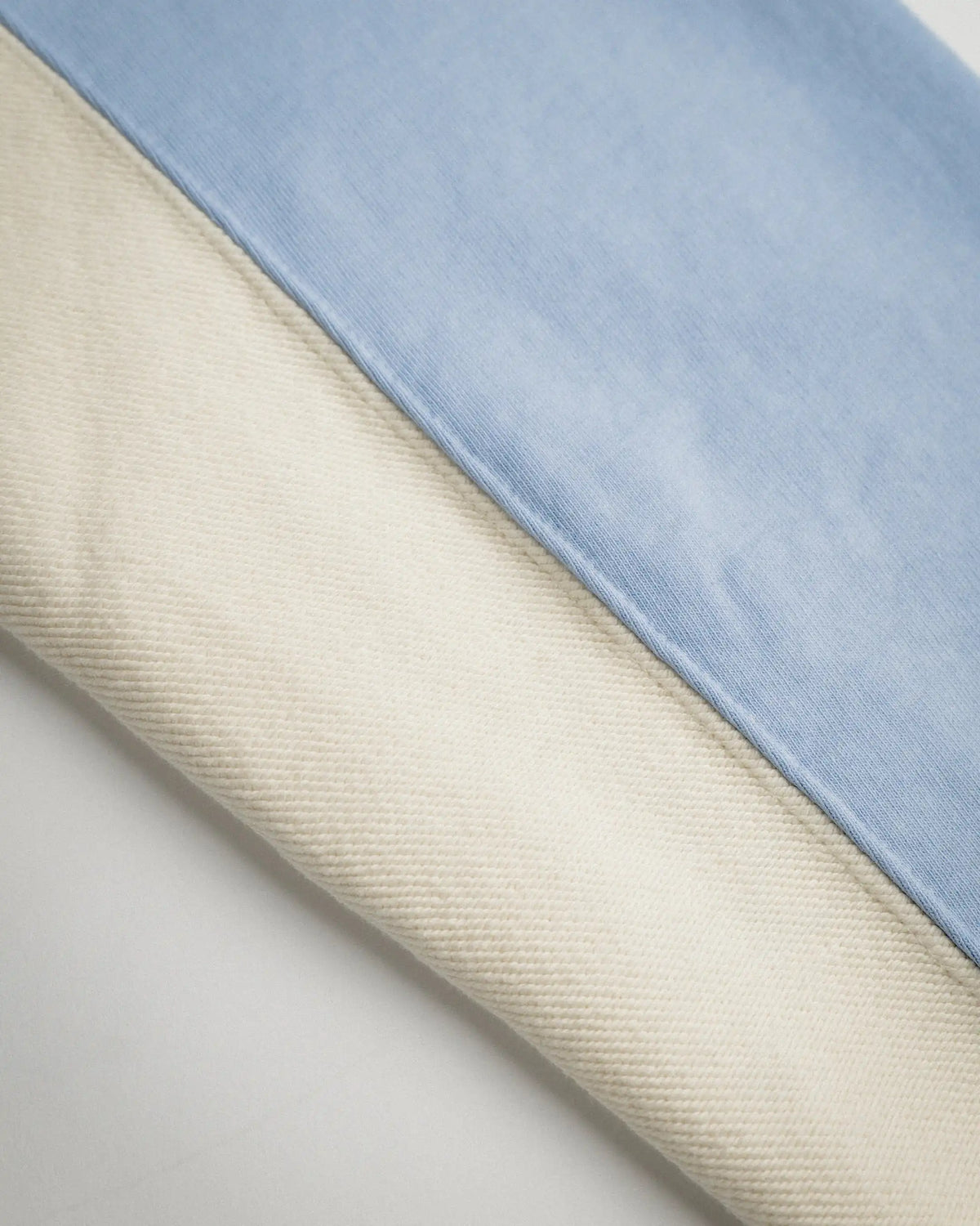 Hoodie Flower GTR Heavy Baby Blue, detail of the cream sleeve panel and its seam