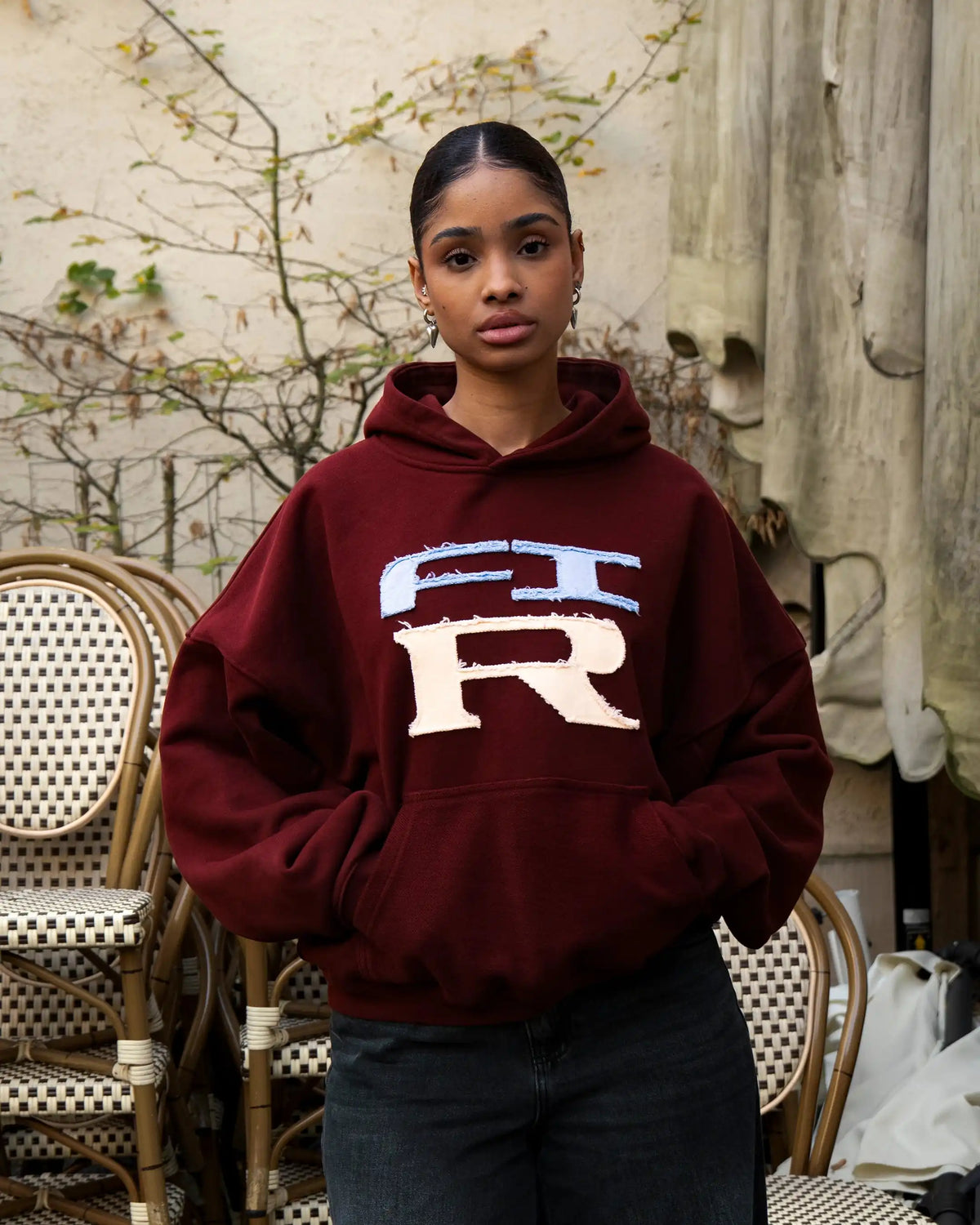 Hoodie Flower GTR Heavy Red Bordeaux worn, front, outdoors on a terrace with black pants