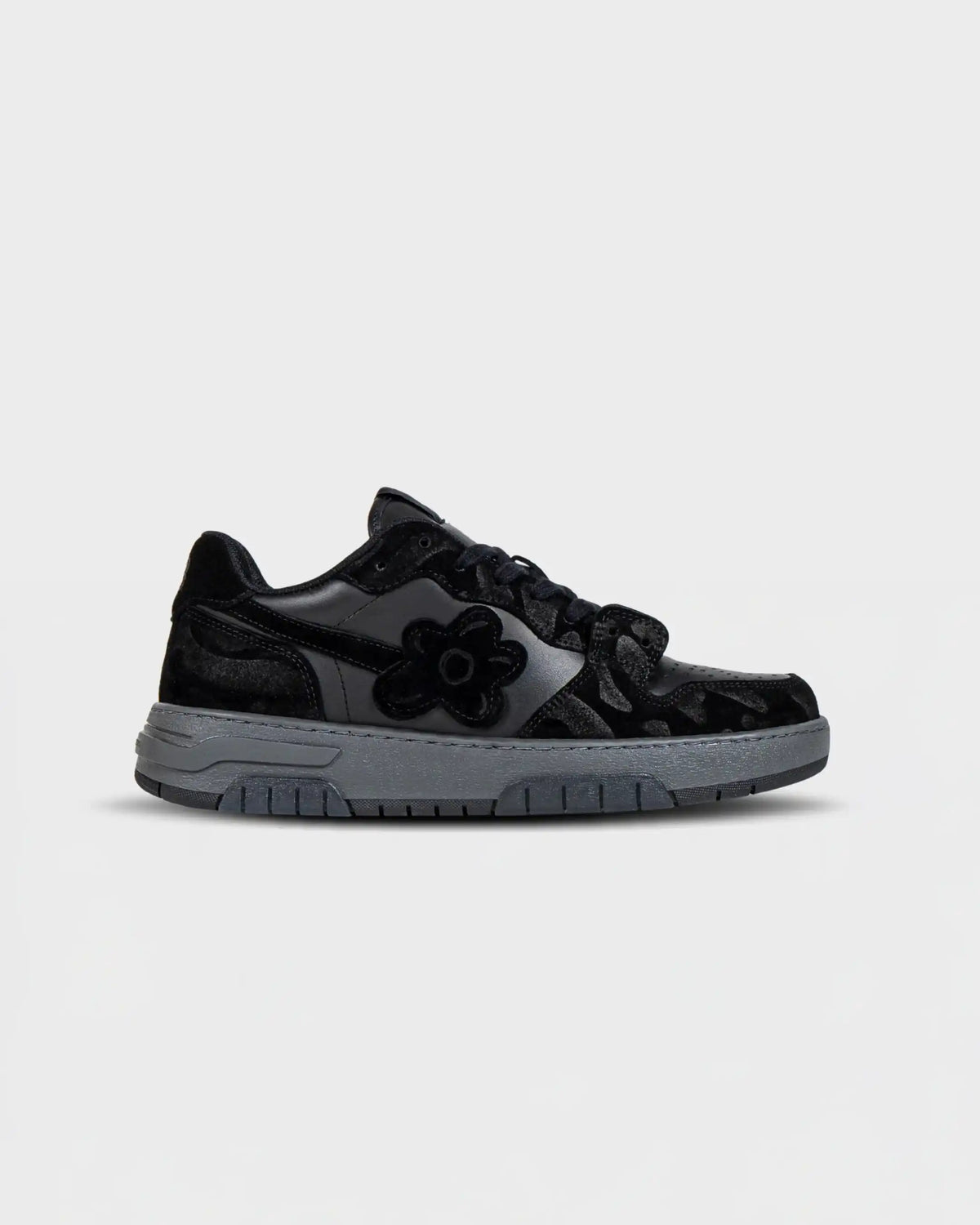 Flin Black Ash sneaker in black Italian suede with grey camo panels and grey sole, side view
