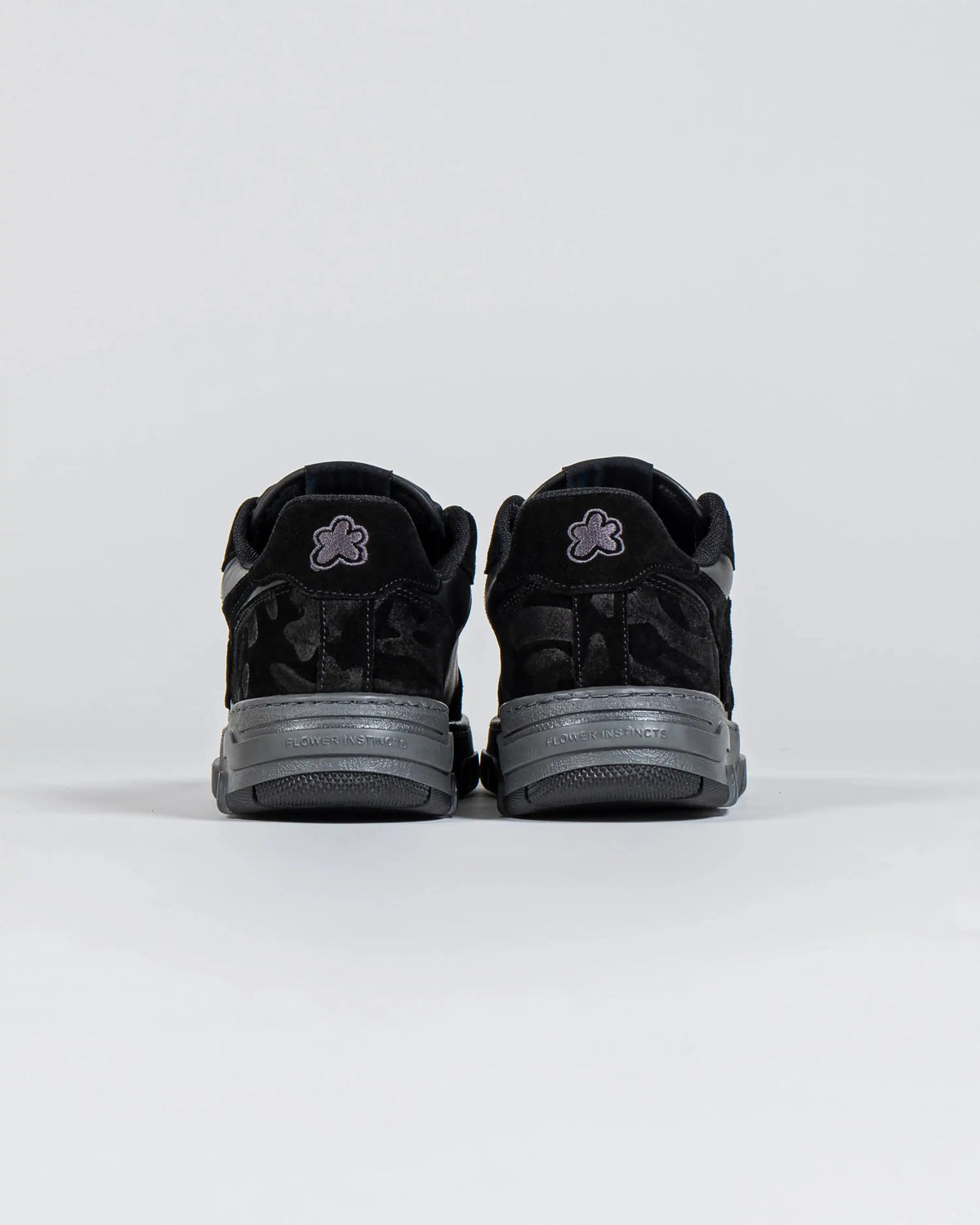 Flin Black Ash, heel view of the pair with the Flower heel patches