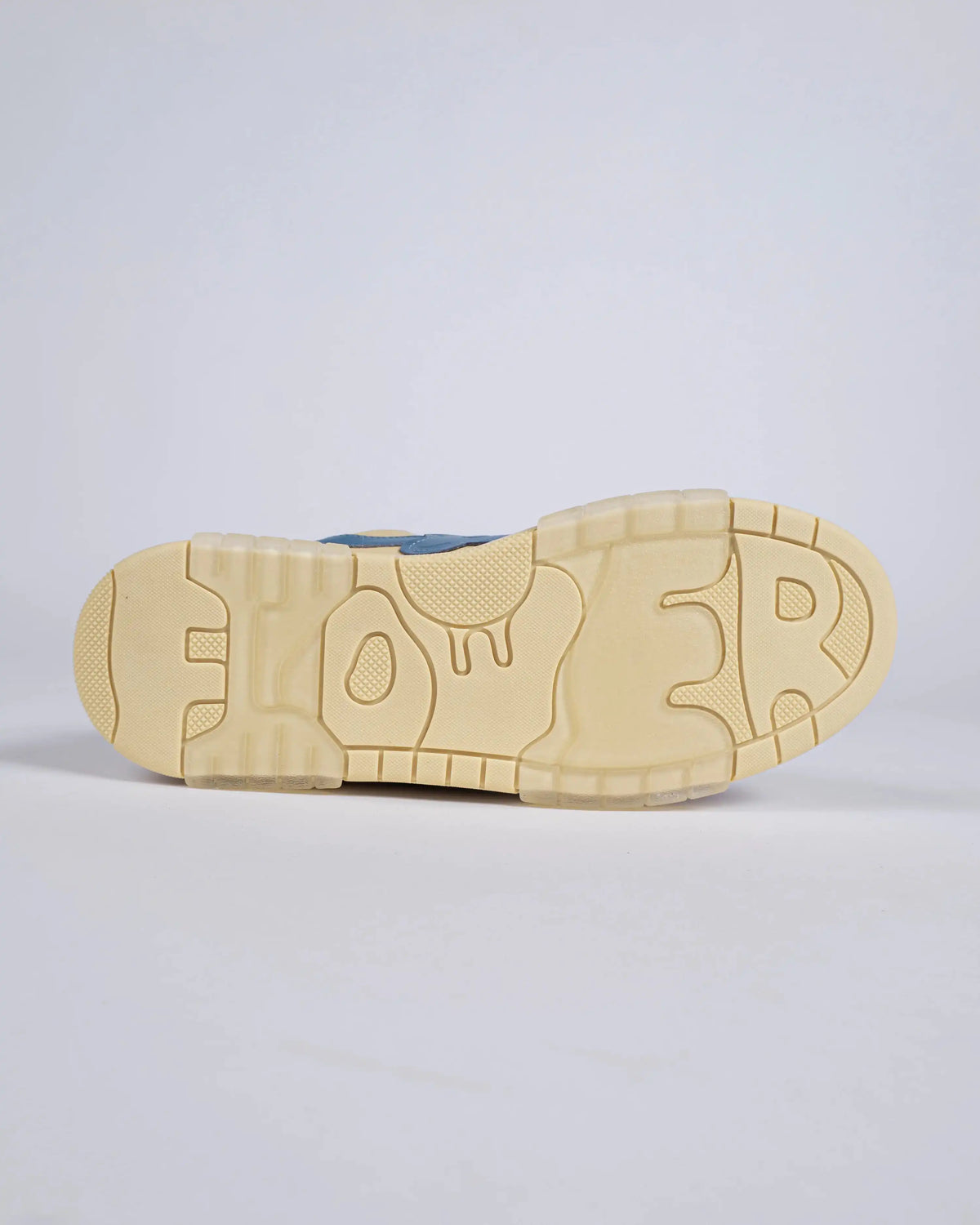 Flin Fenta, sole view with the Flower lettering on the yellow outsole