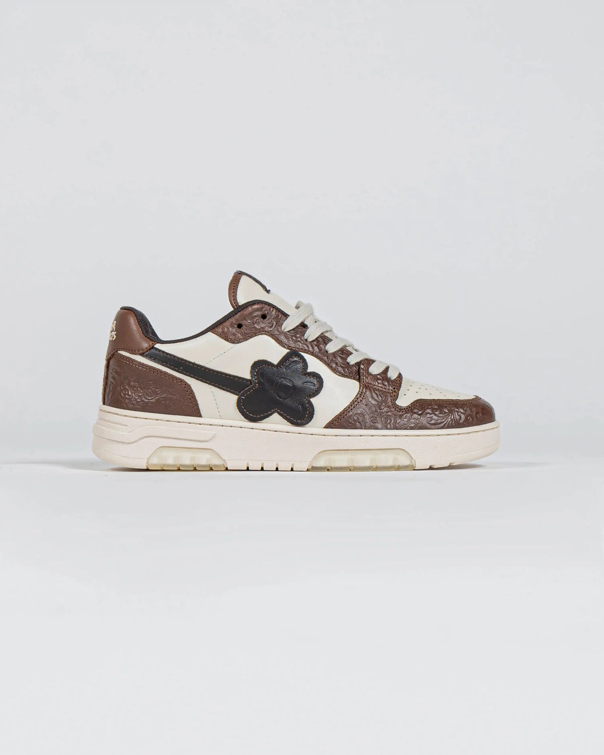 Flin Tobacco sneaker in brown and cream Italian leather with a black Flower, side view