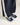 Flower Instincts Daytona Blue Hour sneaker worn with black trousers