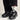 Flower Instincts Daytona Midnight sneaker worn with black trousers